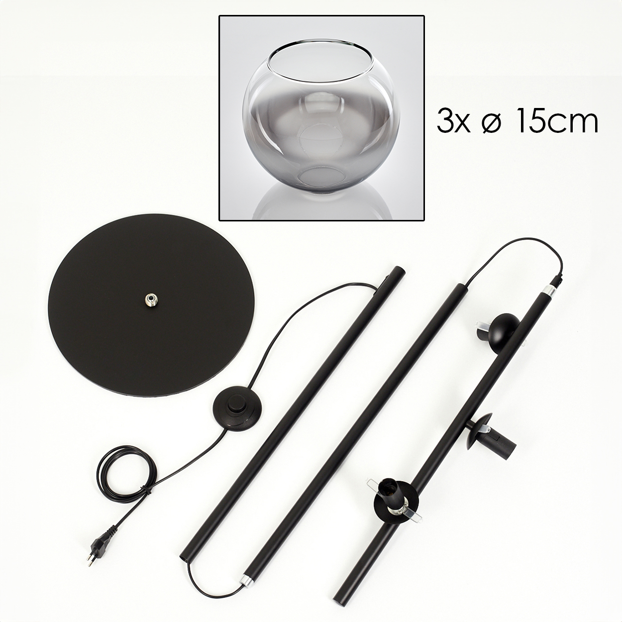 Eine zerlegte schwarze Stehlampe mit kreisförmigem Fuß, Stäben und einer runden Glasschale. Text zeigt, dass die Schale 15 cm Durchmesser hat.