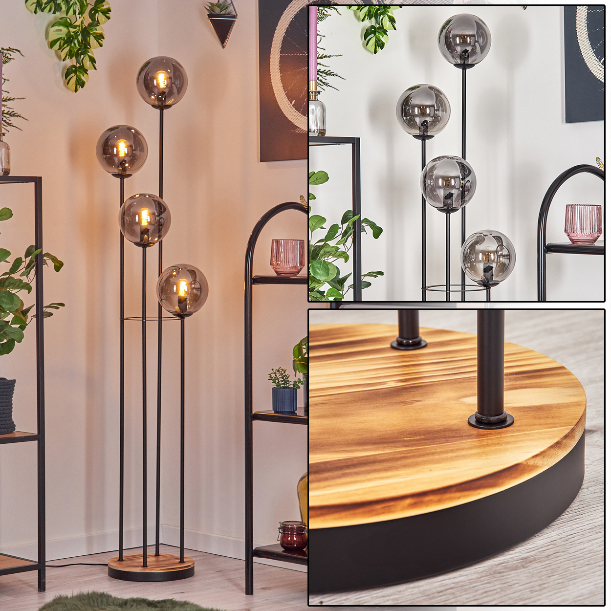 Eine moderne Stehlampe mit vier Glaskugellampen. Sie steht auf einem Holzsockel mit schwarzen Metallstützen, umgeben von Regalen und Pflanzen.