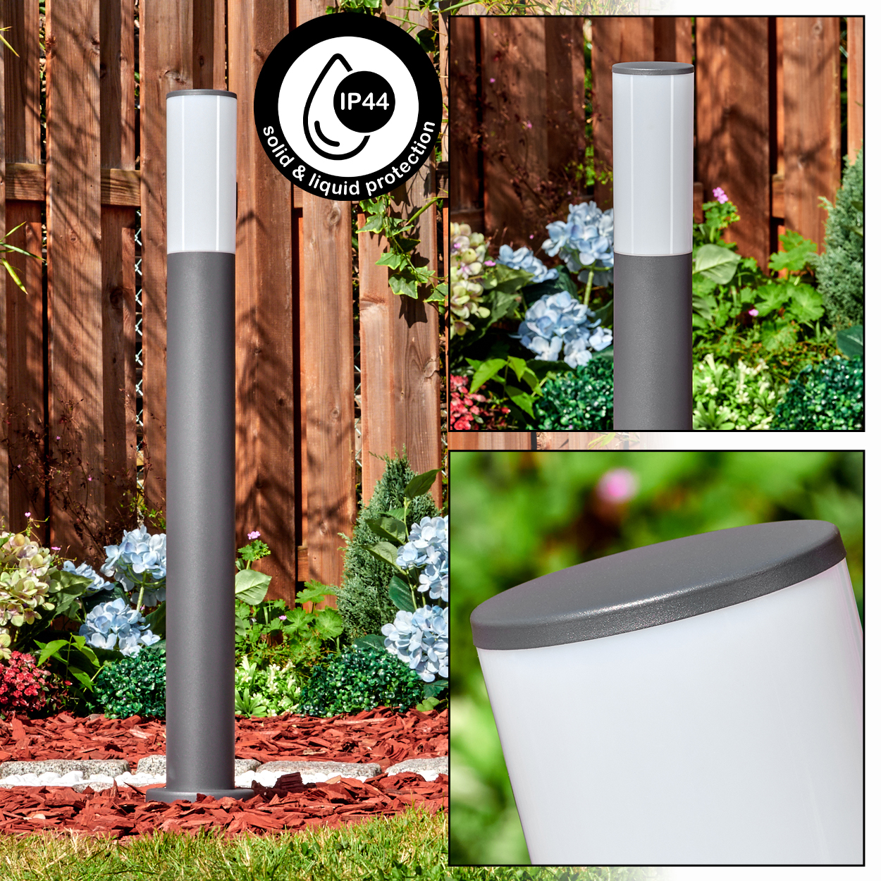 Eine grau-weiße Außenlampe steht in einem Garten. Der Hintergrund zeigt einen Holzzaun, Blumen und andere Pflanzen.
