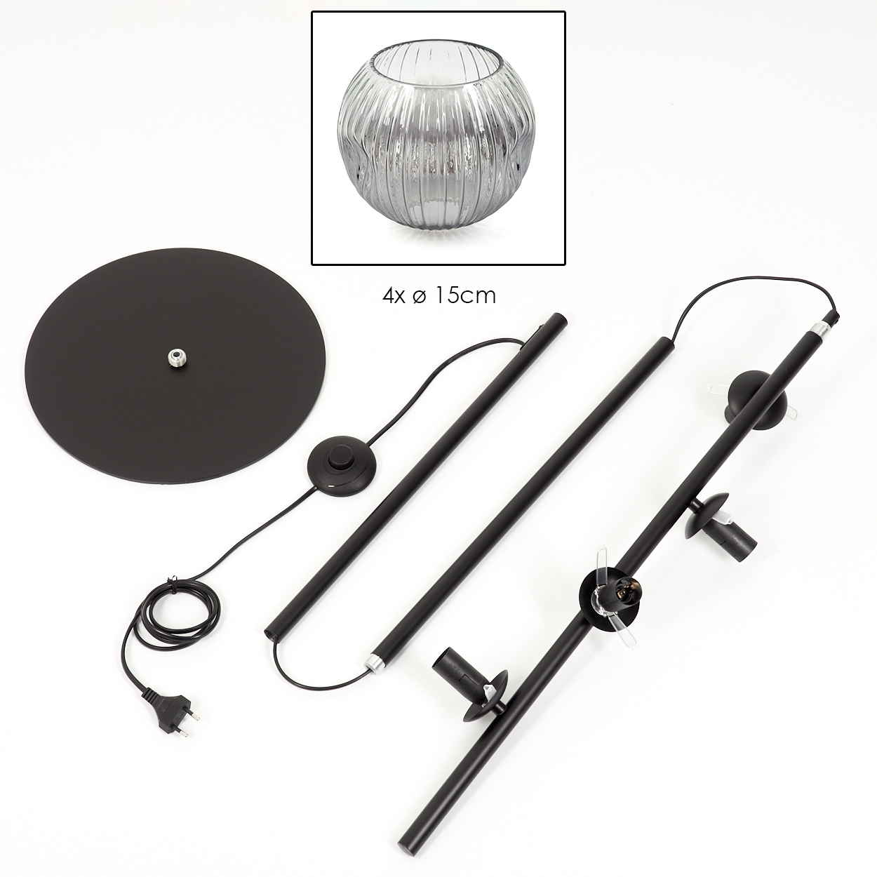 Zerlegte schwarze Stehlampe mit rundem Sockel, Stiel und Leuchte. Eine Glasschale befindet sich in der oberen linken Ecke.