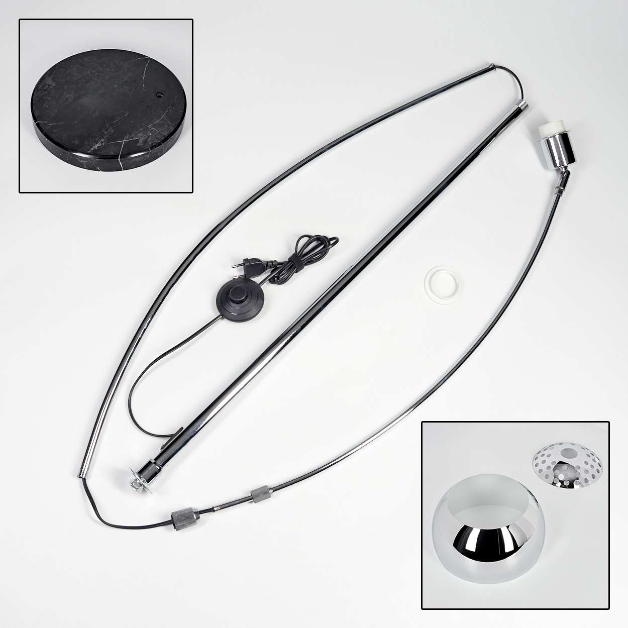 Zerlegte moderne Lampe. Teile umfassen schwarzen Marmorsockel, Chromstangen, Glühbirnenhalter, Schalter und Lampenschirm.
