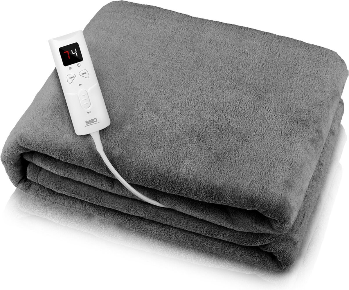 A gray electric blanket with a white control panel displaying '74'. The blanket is folded neatly, showing layered sections.