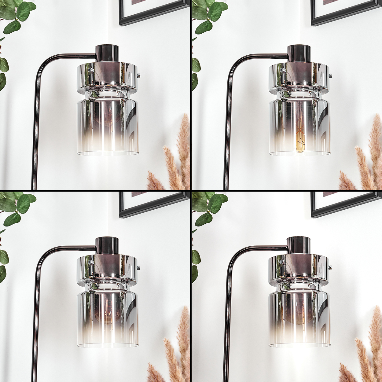 Moderne Lampe mit Chrom-Finish und rauchfarbenem Glasschirm. Die Lampe steht an einer weißen Wand. Grüne Blätter und Pampasgras.