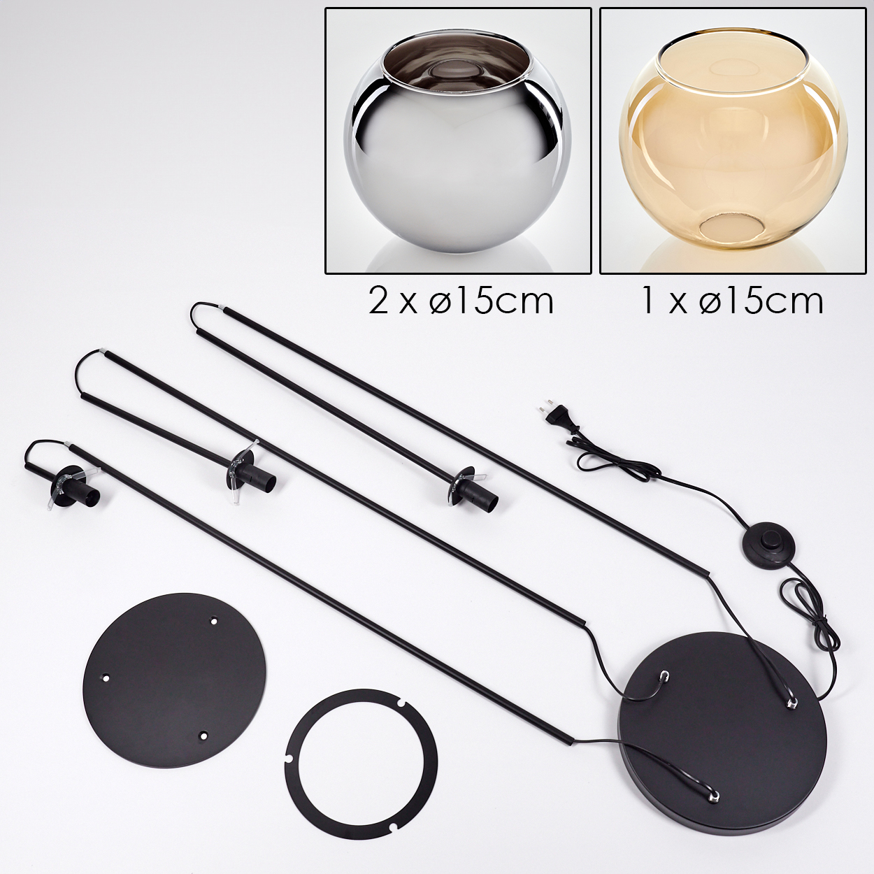 Das Bild zeigt Teile einer Lampe. Es gibt zwei Glasschalen, eine silberne und eine bernsteinfarbene. Außerdem gibt es schwarze Metallteile und einen Sockel.