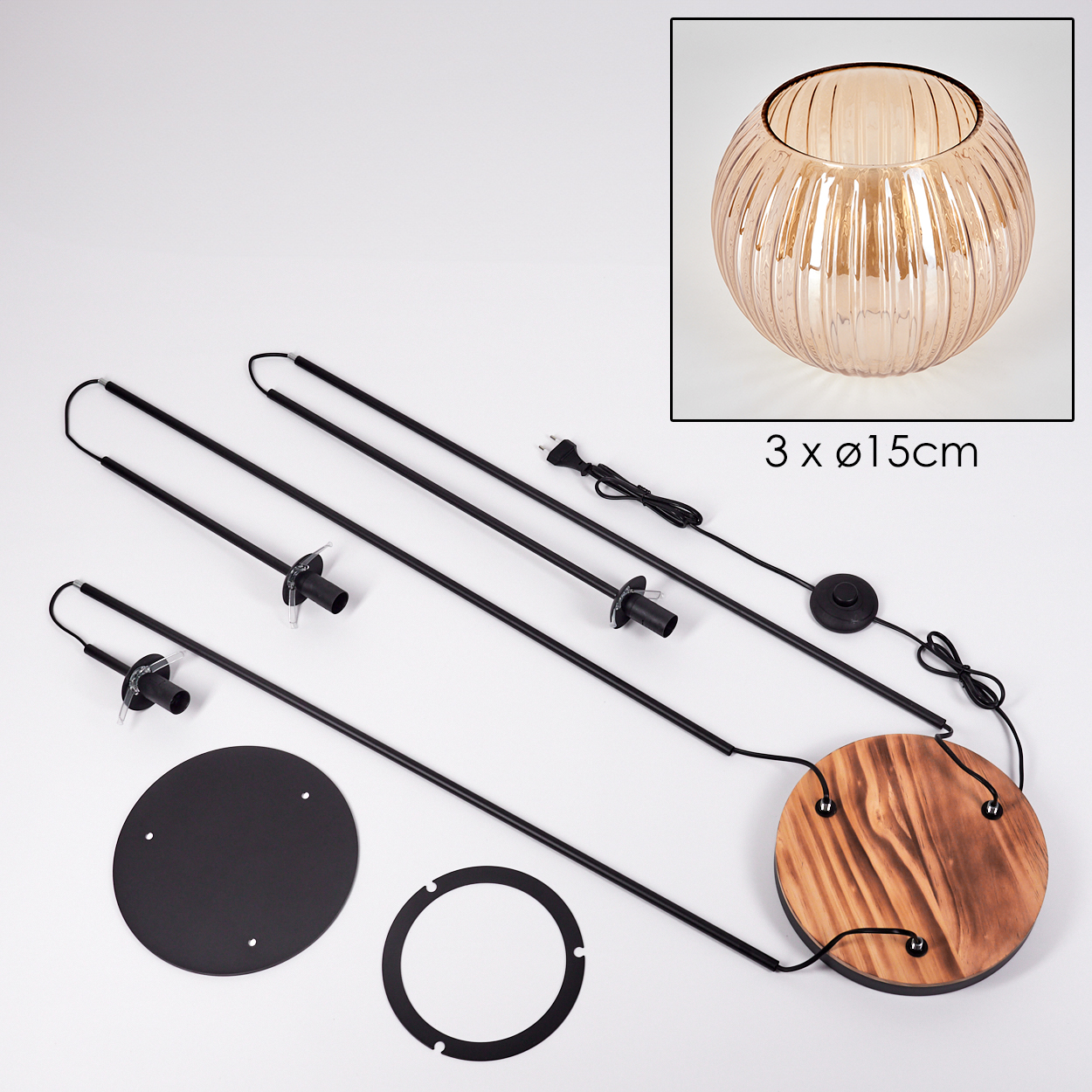 Zerlegte Lampenkomponenten: schwarze Stäbe, Holzsockel, Glaslampenschirm (oben rechts), schwarzer und weißer Ring und ein schwarzer Sockel.