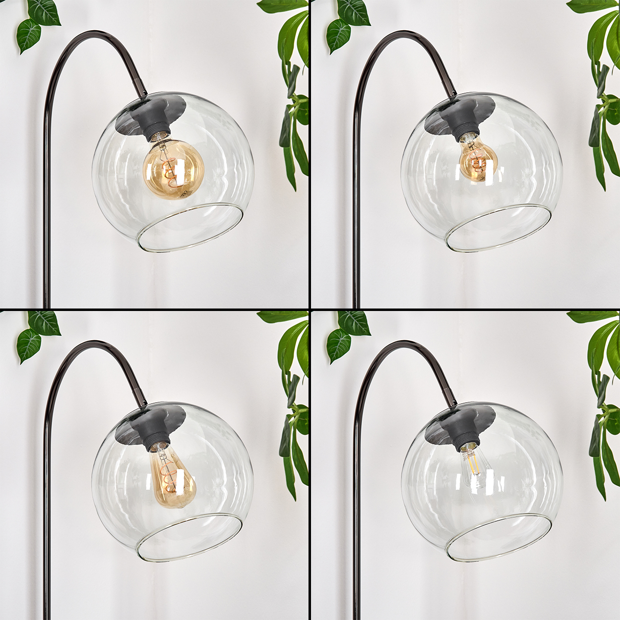 Vier Lampen mit Glaskugeln und sichtbaren Glühbirnen. Dunkler Metallrahmen. Grüne Blätter im Hintergrund vor einer weißen Wand.