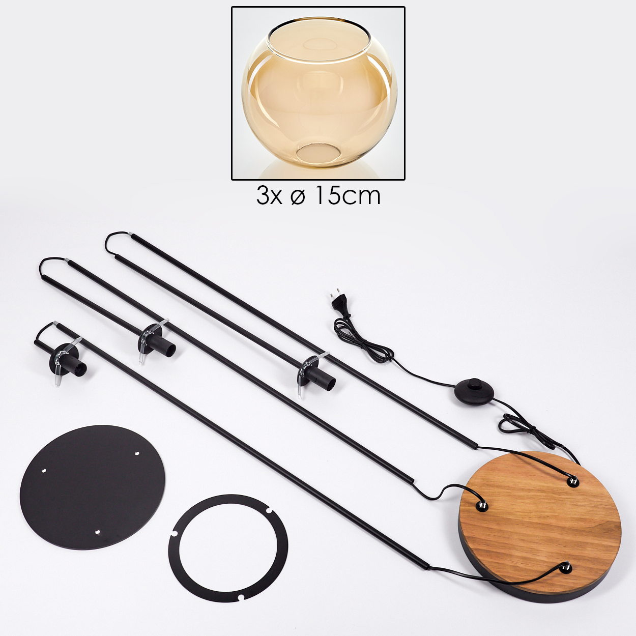 Zerlegte Lampenteile. Glasschale, schwarze Stäbe, Holzsockel, Metallringe und elektrische Komponenten auf weißer Oberfläche.
