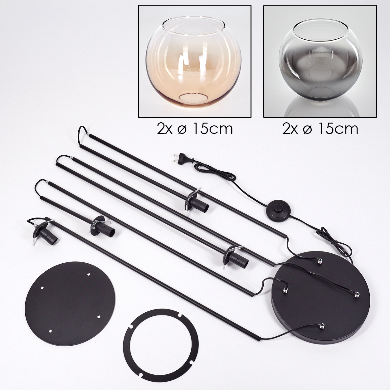 Ein zerlegtes Lampen-Set mit zwei Glasschalen, schwarzen Metallstangen, einem runden Sockel und einem Fußschalter auf weißem Untergrund.