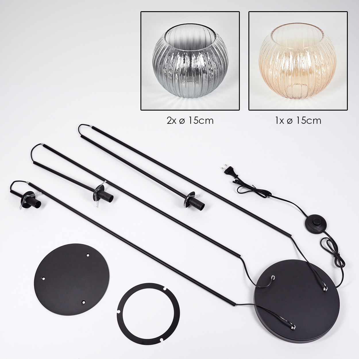 Das Bild zeigt zerlegte Teile einer Lampe. Es enthält Glasschalen, schwarze Metallstäbe, eine kreisförmige Basis und andere Komponenten.