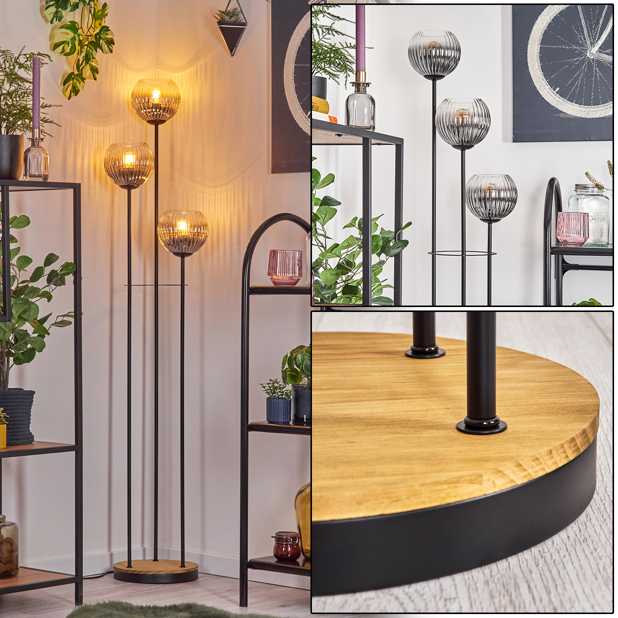Eine Stehlampe mit drei Glaskugelschirmen. Der Sockel ist aus Holz und schwarzem Metall. Regale mit Pflanzen und Dekor befinden sich im Hintergrund.
