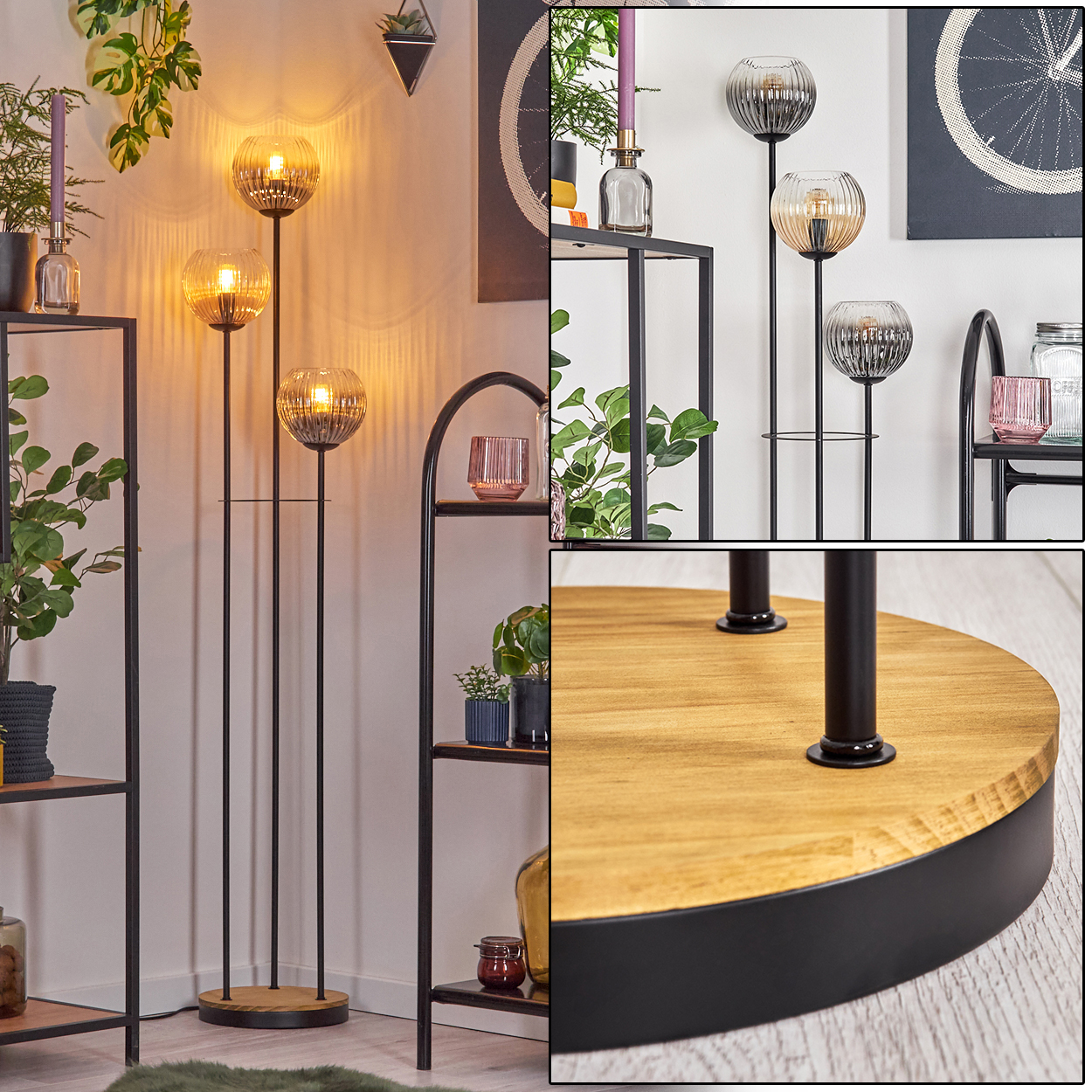 Eine Stehlampe mit drei Glaskugelleuchten steht vor einer weißen Wand. Regale mit Pflanzen und Dekoration umgeben sie.