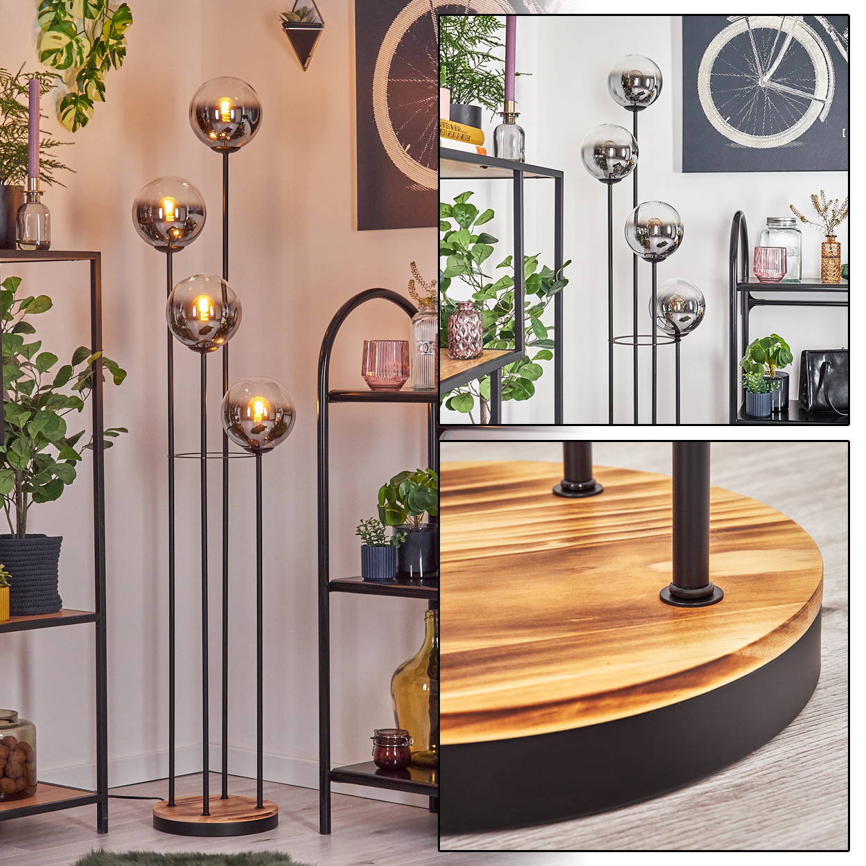 Eine Stehlampe mit vier Glaskugellampen auf Holzsockel. Regale mit Pflanzen, Kerzen und Dekorationsartikeln sind sichtbar.