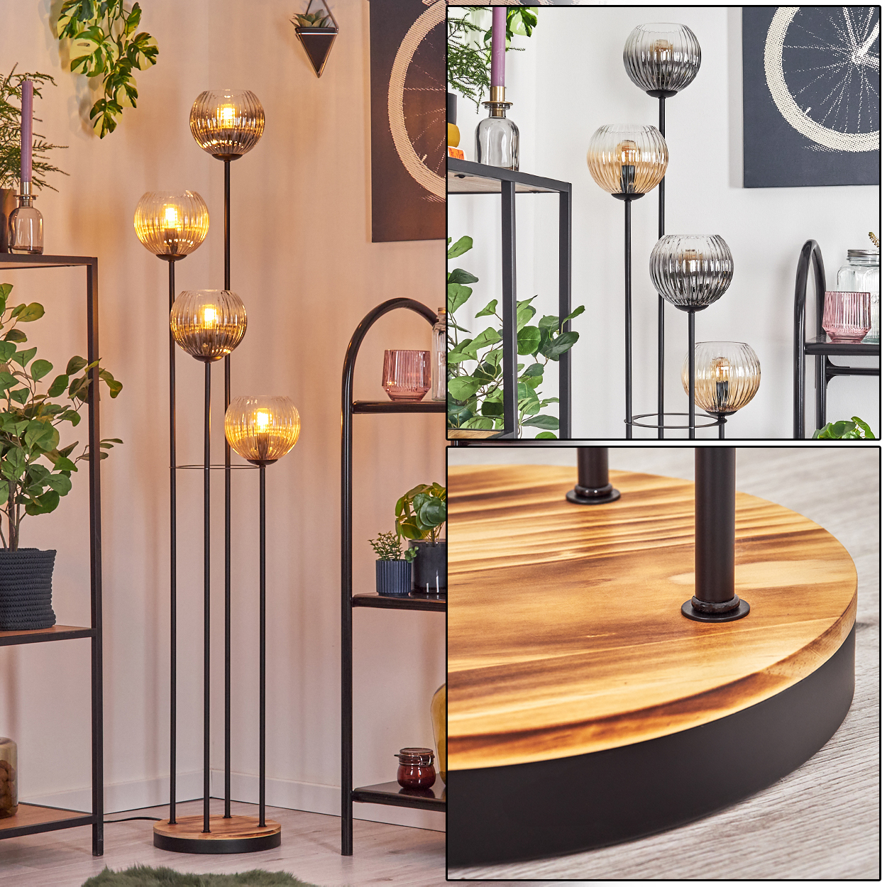 Eine Stehlampe mit vier Glaskugellampen, schwarzem Metallrahmen und Holzsockel. Pflanzen, Regale und Kunstwerke im Hintergrund.