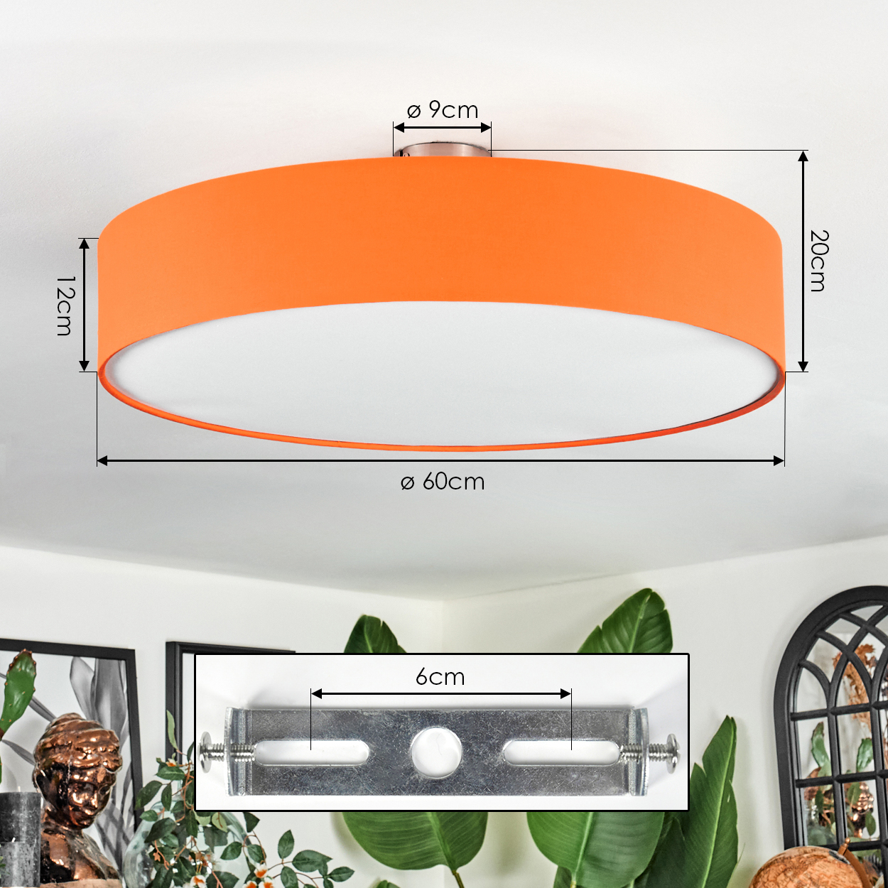 Eine orangefarbene Deckenlampe mit Maßangaben. Die Lampe ist kreisförmig mit weißem Innenraum und Metallhalterung.