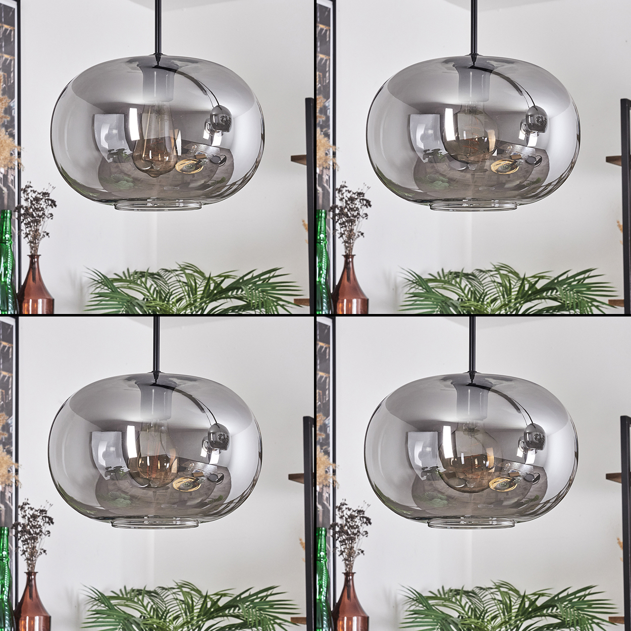 Vier Pendelleuchten mit grauen Glasschirmen. Jede hat eine Glühbirne. Pflanzen und Vasen sind im Hintergrund.