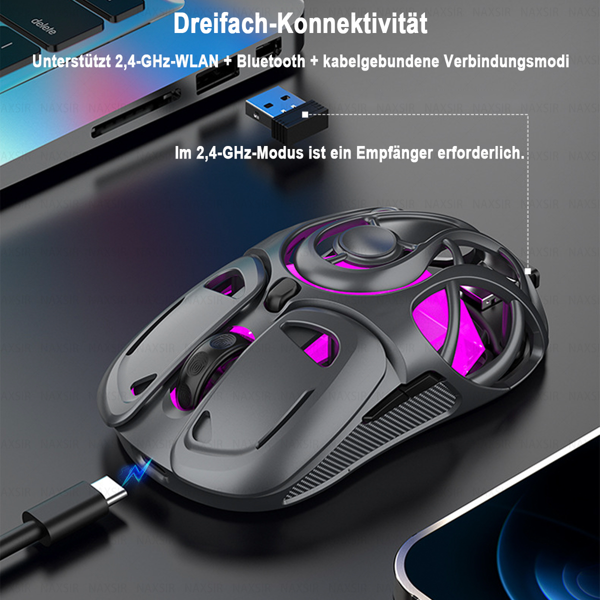 Eine graue kabellose Maus mit rosa Beleuchtung ist über einen USB-Empfänger mit einem Laptop verbunden. Rechts ist ein Telefon.
