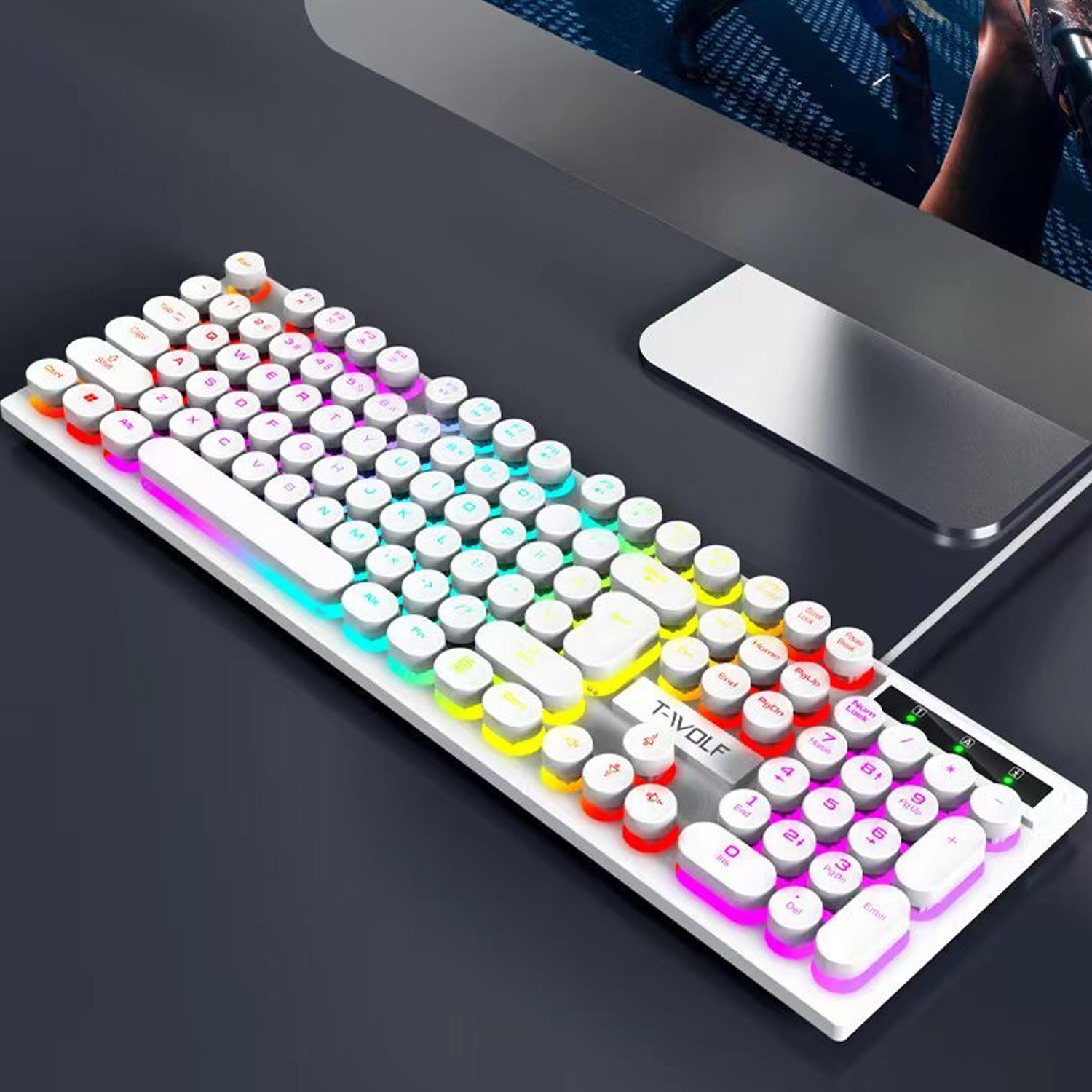 Eine weiße Tastatur mit bunten Tasten. Die Tasten sind rund und die Tastatur liegt auf einer dunklen Oberfläche.