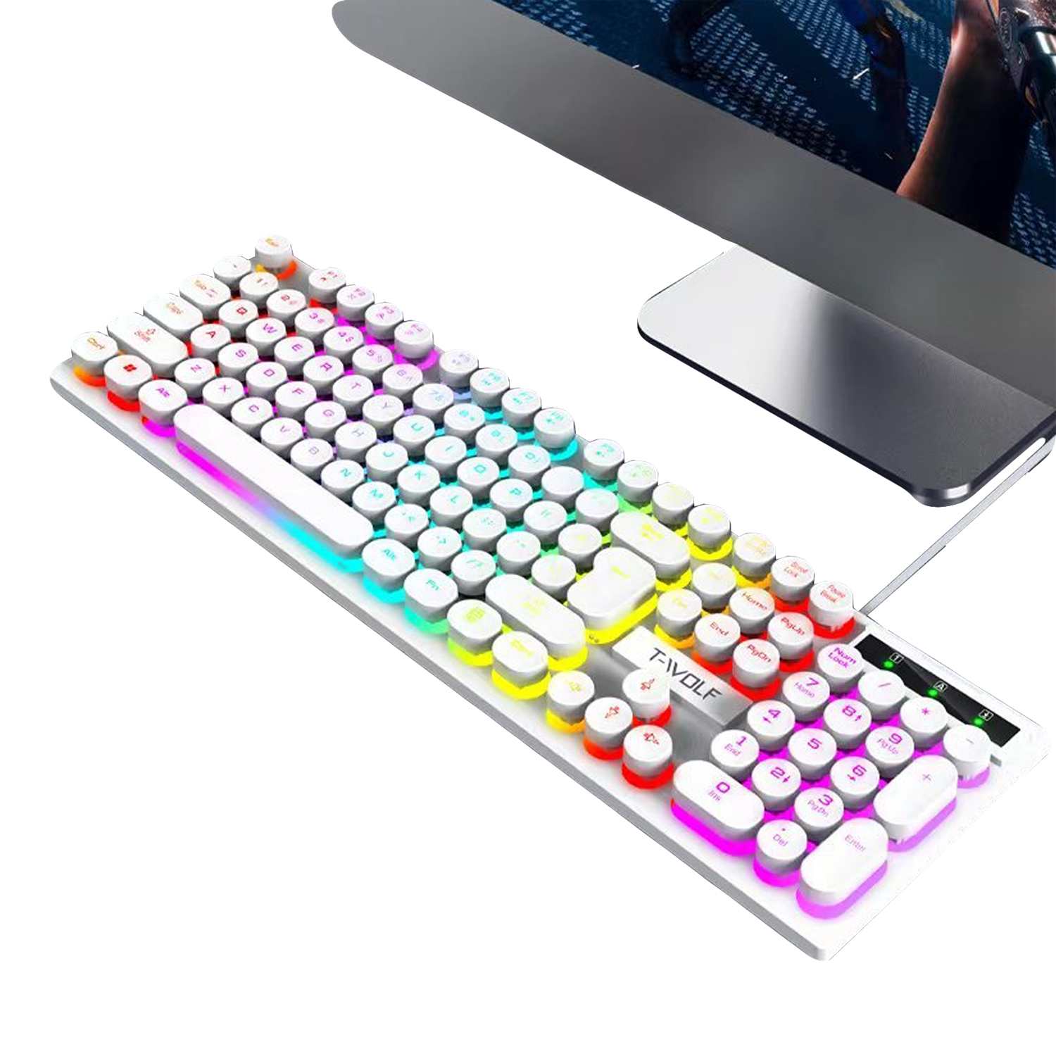 Eine weiße und farbenfrohe Tastatur liegt vor einem Computermonitor. Die Tastatur hat runde Tasten mit mehreren Farben.