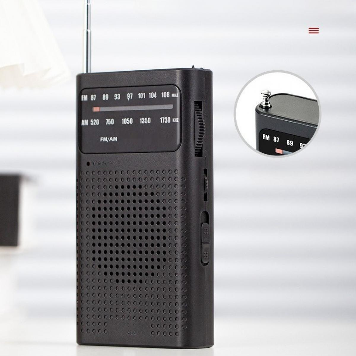 Ein schwarzes tragbares Radio mit Antenne. Es hat UKW/MW-Frequenzen und einen Abstimmregler an der Seite. Eine Nahaufnahme zeigt die UKW-Frequenzen.