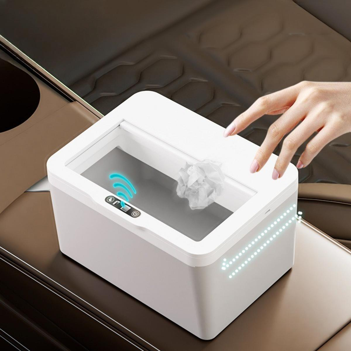 Ein weißer Auto-Mülleimer, auf den eine Hand zeigt. Ein zerknittertes Papier liegt darin. Die Szene spielt in einem Auto.