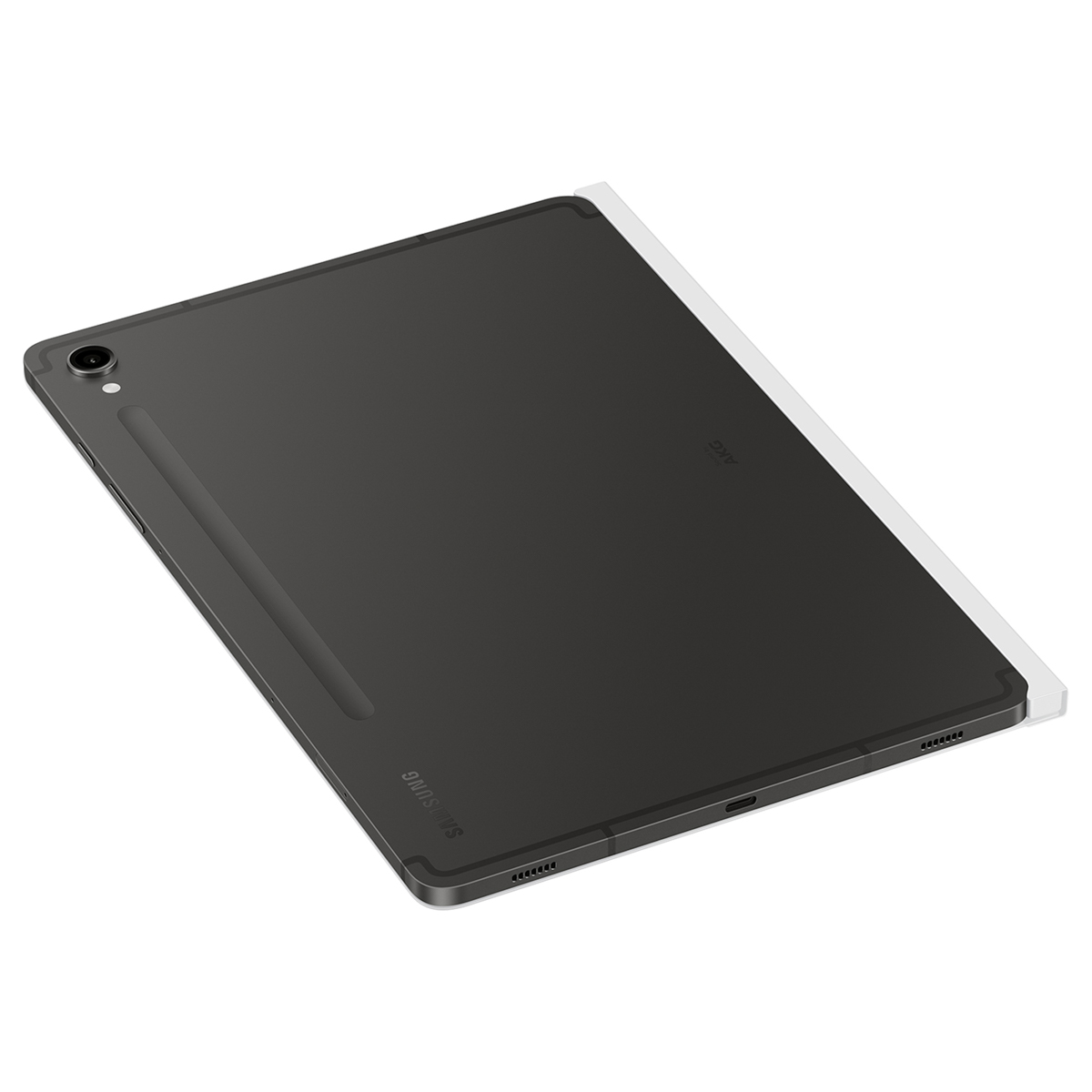 Tableta Samsung gris oscuro con un lápiz óptico. La tableta descansa sobre una cubierta blanca, en una superficie blanca.