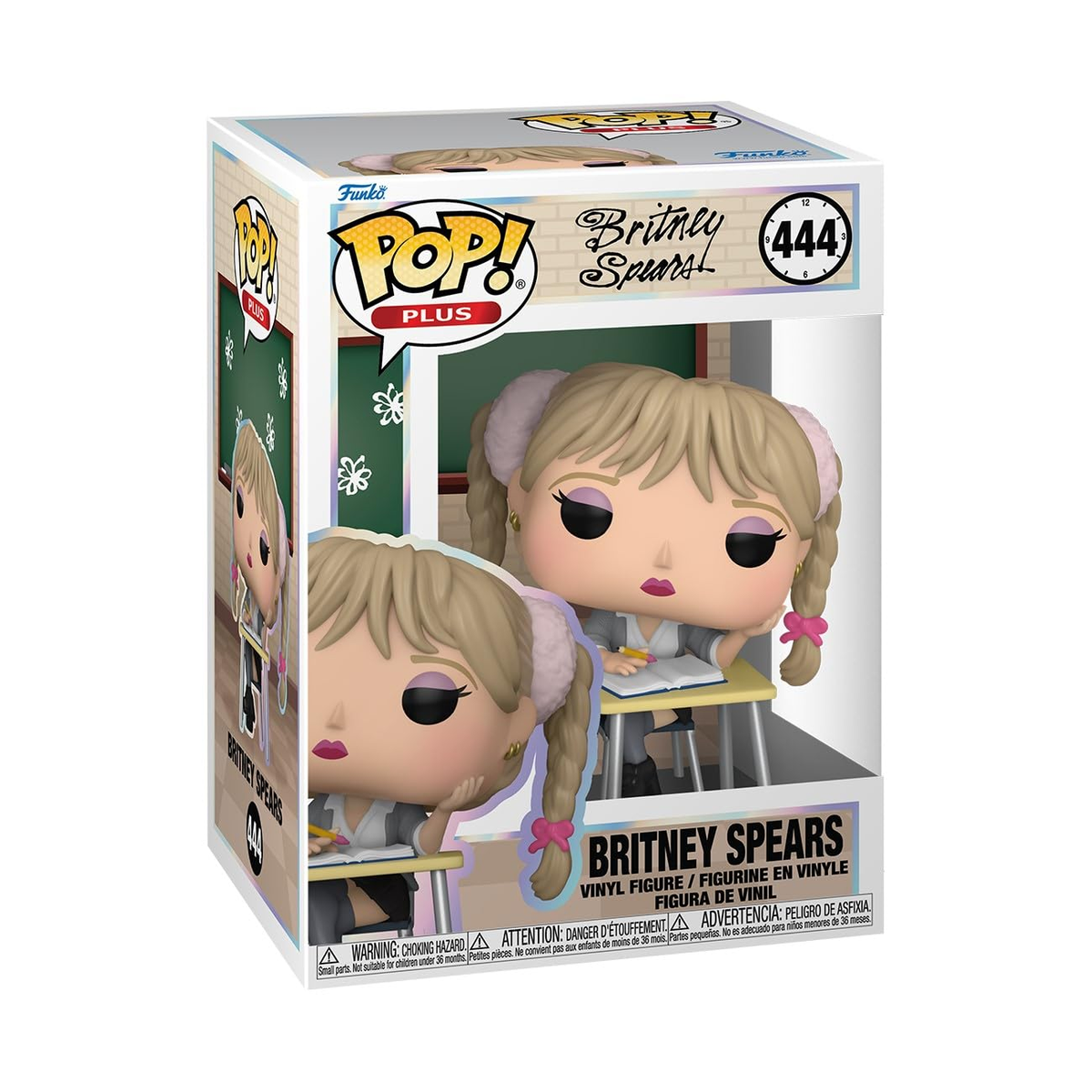 Una figura de vinilo Funko Pop! de Britney Spears con un atuendo de colegiala, dentro de una caja. El fondo muestra un aula.