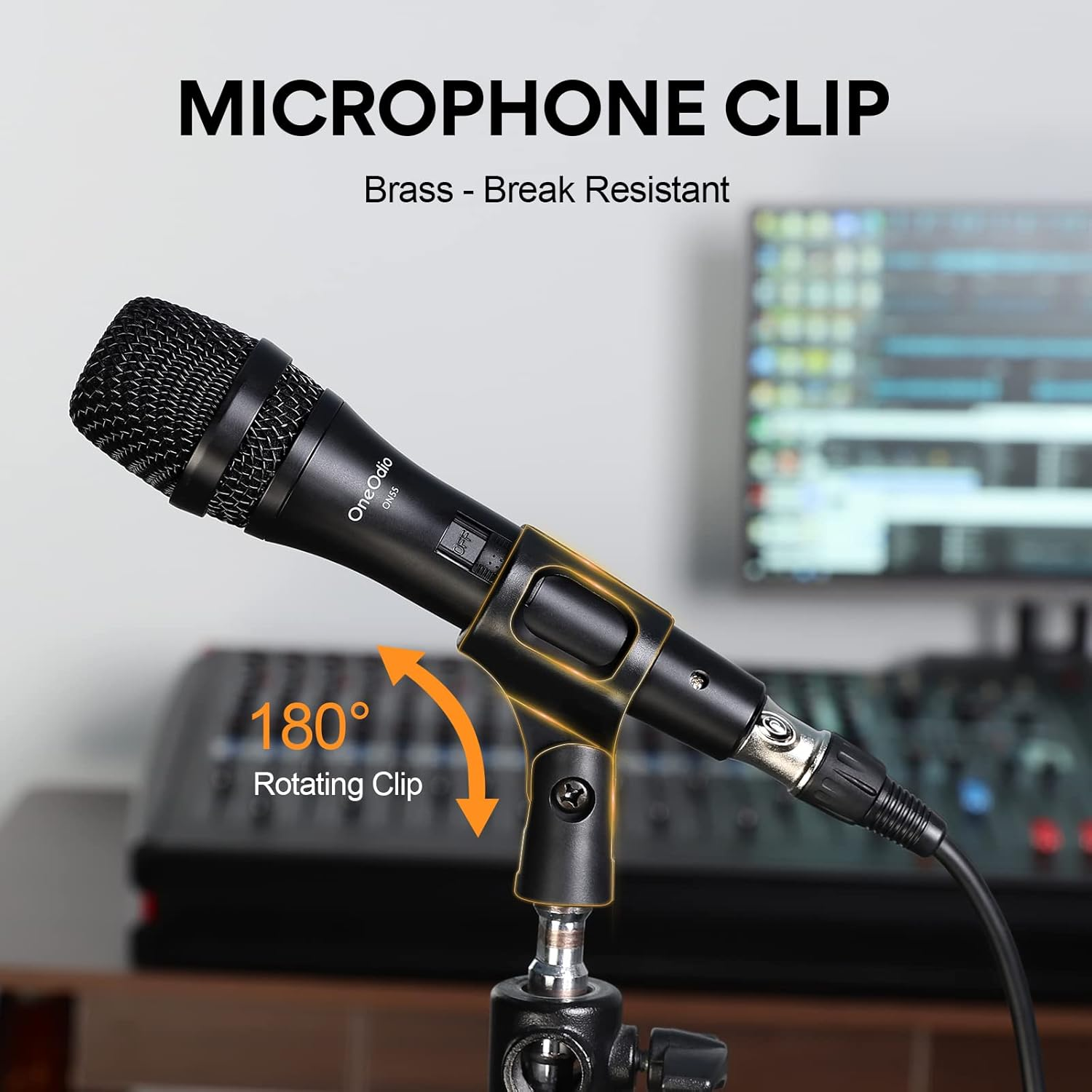 A black microphone in a clip, with a 180-degree rotating feature, text says 'Microphone Clip'. Background blurry studio equipment.
