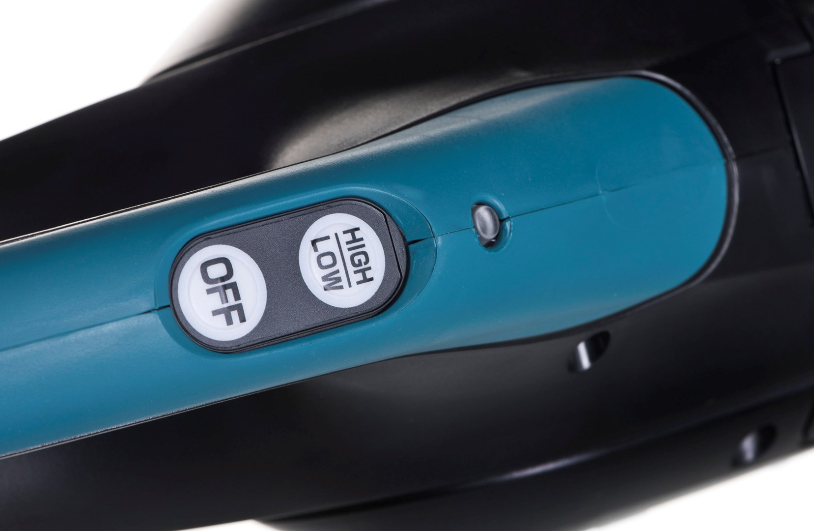 Close-up of a teal and black device. It has an 'OFF' button and a 'HIGH LOW' button. A small silver button is also visible.