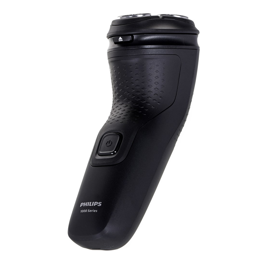 Czarna golarka elektryczna Philips serii 1000, widok z boku. Posiada przycisk zasilania, teksturowany uchwyt i głowice golące na białym tle.