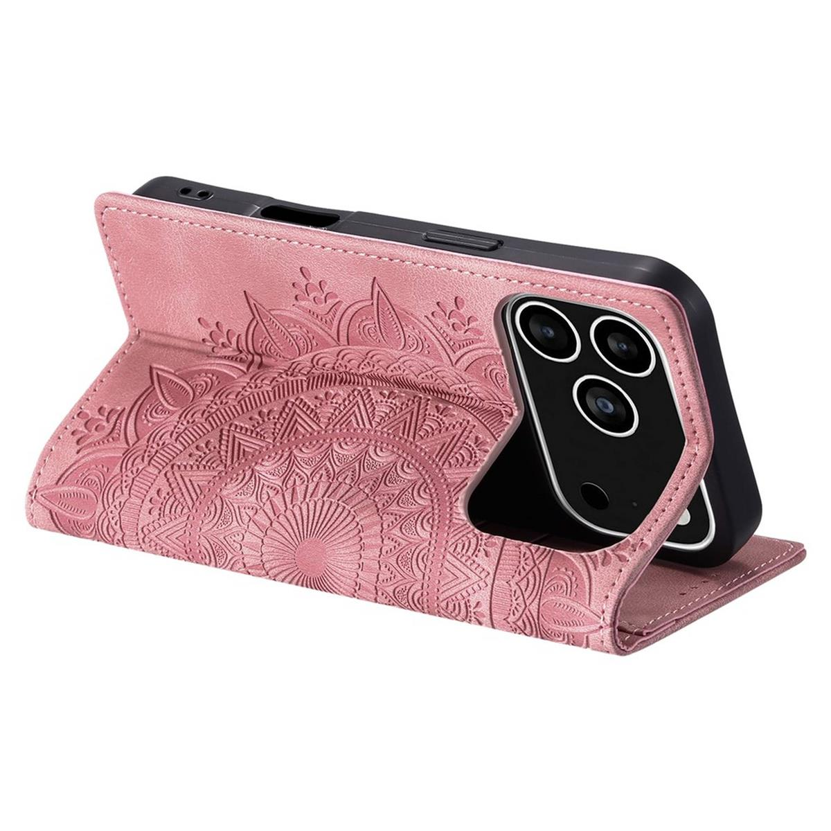 Eine rosa Handyhülle mit Mandala-Design hält ein schwarzes Telefon. Die Hülle ist geöffnet und zeigt die Kameralinsen des Telefons.