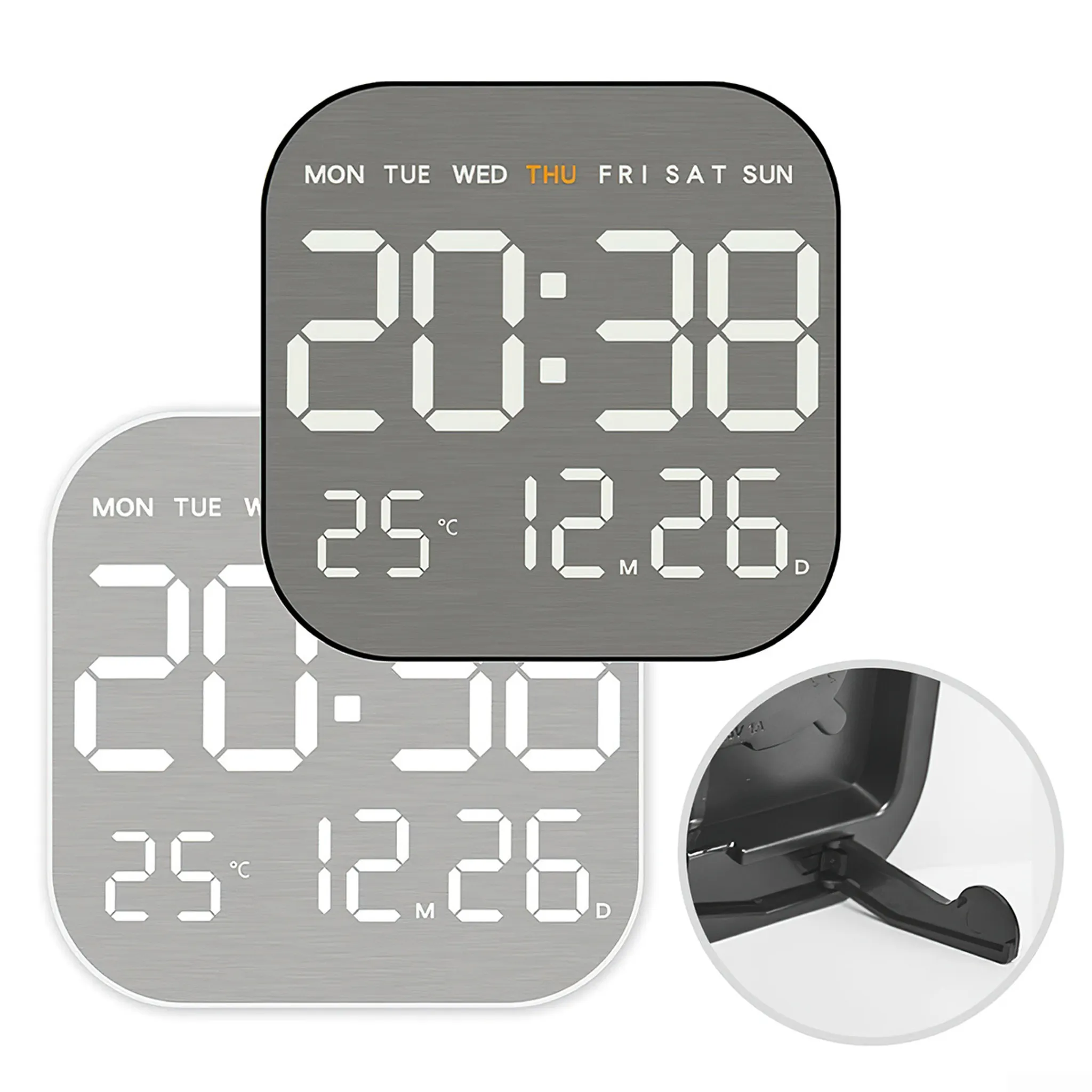 Digitaluhr mit Uhrzeit, Datum und Wochentag. Zwei Uhren sind sichtbar, zusammen mit einem schwarzen Ständer.