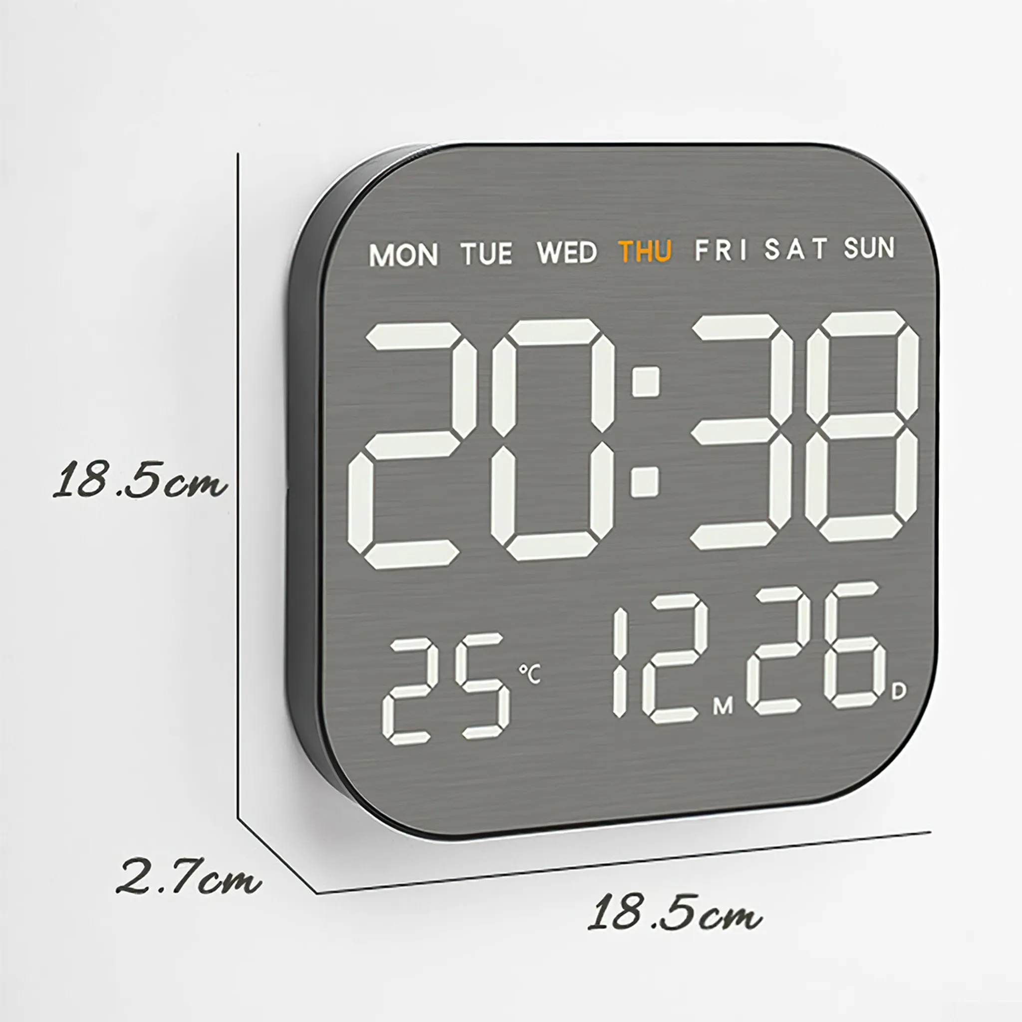 Eine graue Digitaluhr zeigt 20:38 und 25°C 12.26 an. Es ist Donnerstag. Abmessungen: 18,5 cm x 18,5 cm x 2,7 cm.
