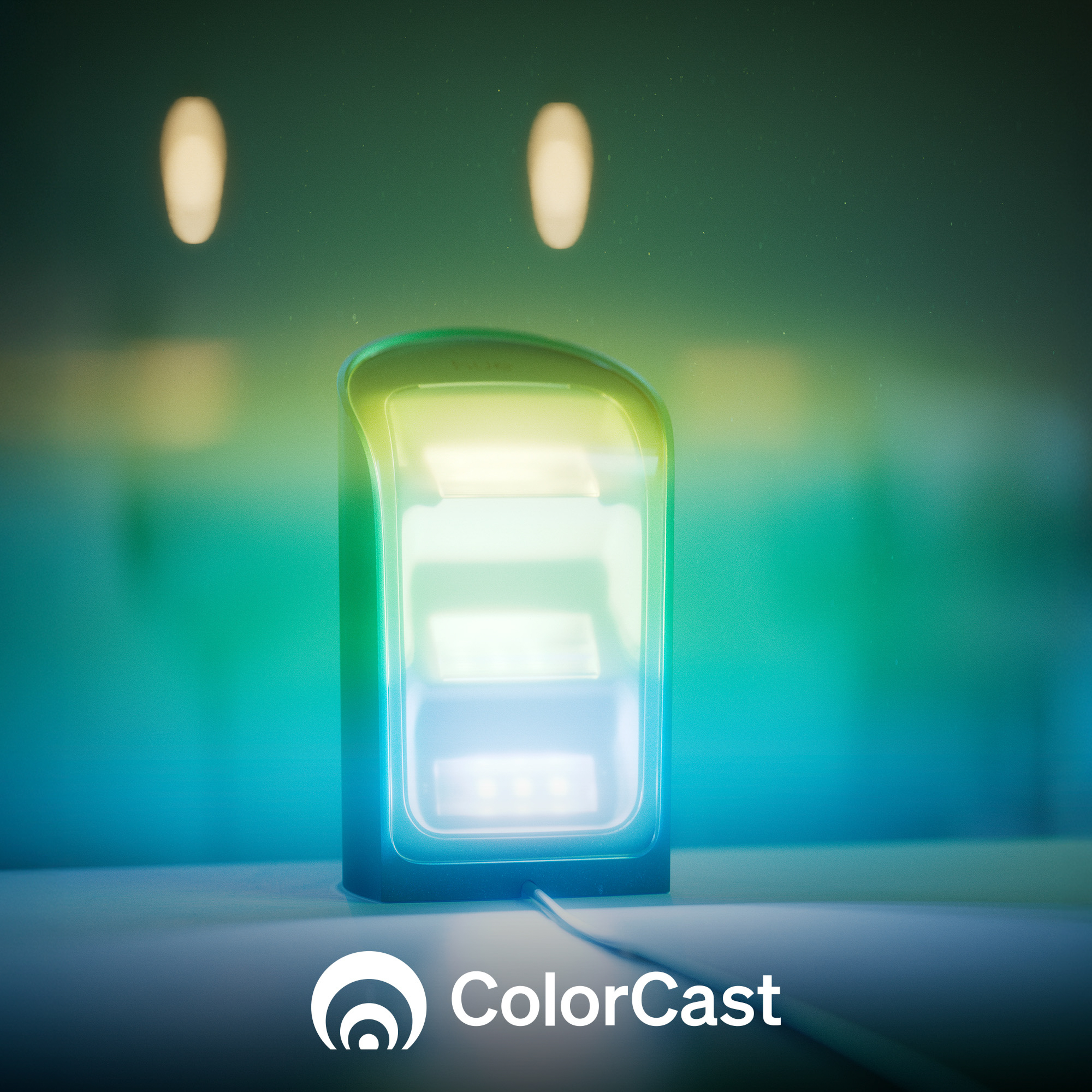 Renk geçişli parlayan bir cihaz bir yüzeyde duruyor. ColorCast logosu sol alt köşede yer alıyor.