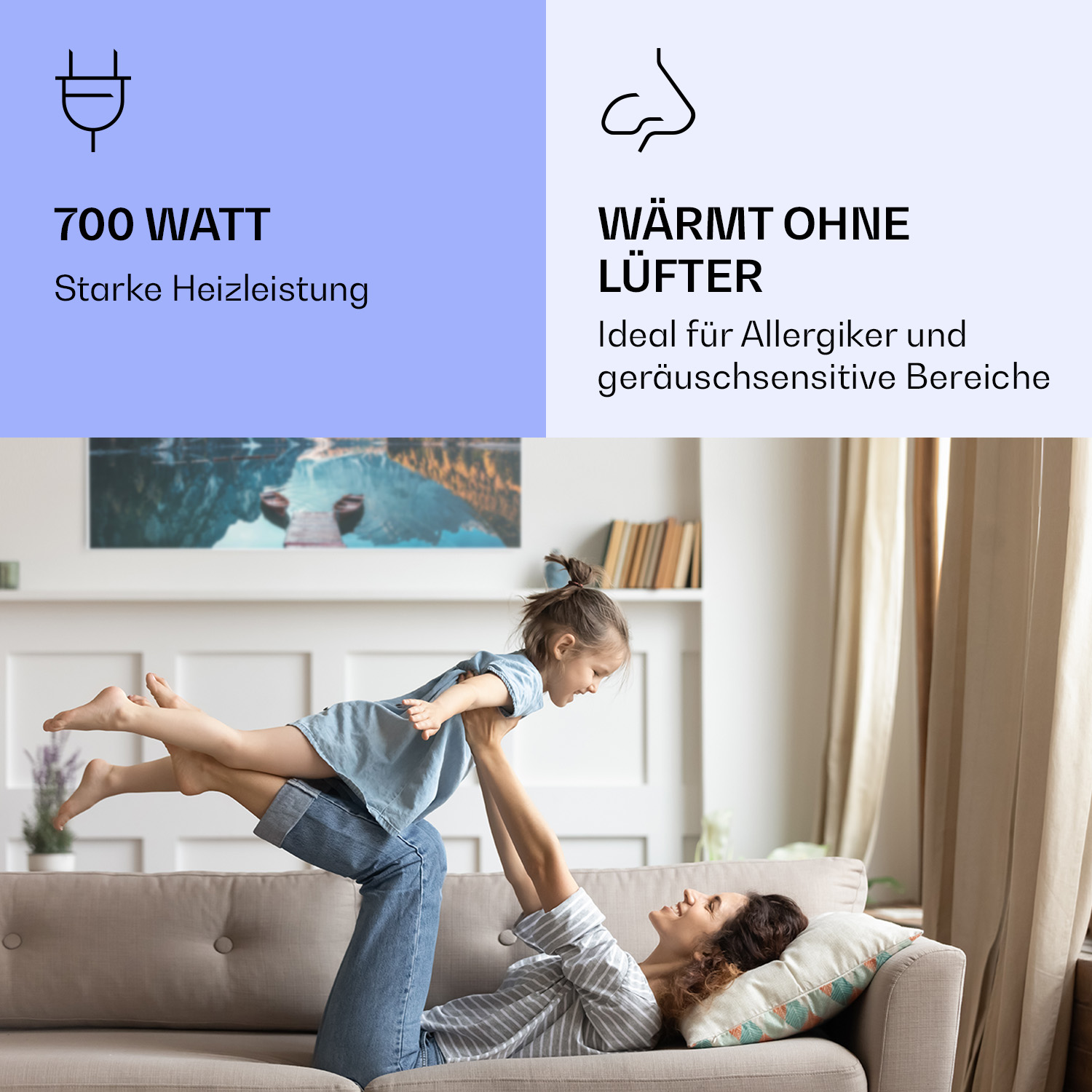 Eine Frau hält ein Kind in der Luft, während sie auf einem Sofa liegt. Der Text oben lautet '700 WATT' und 'WÄRMT OHNE LÜFTER'.