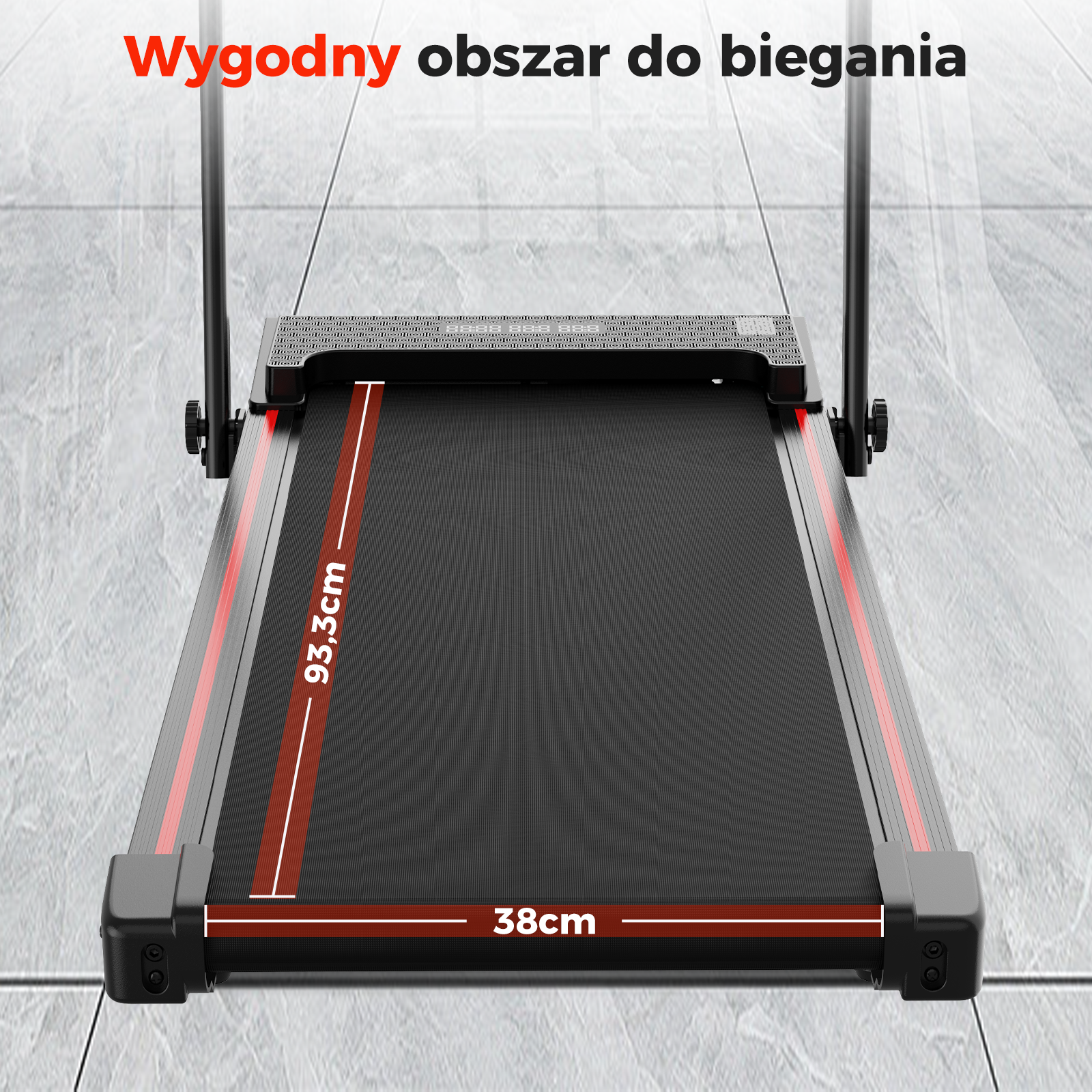 Bieżnia ze zwymiarowanymi elementami. Powierzchnia do biegania ma 93,3 cm długości i 38 cm szerokości. Czarno-czerwony design.