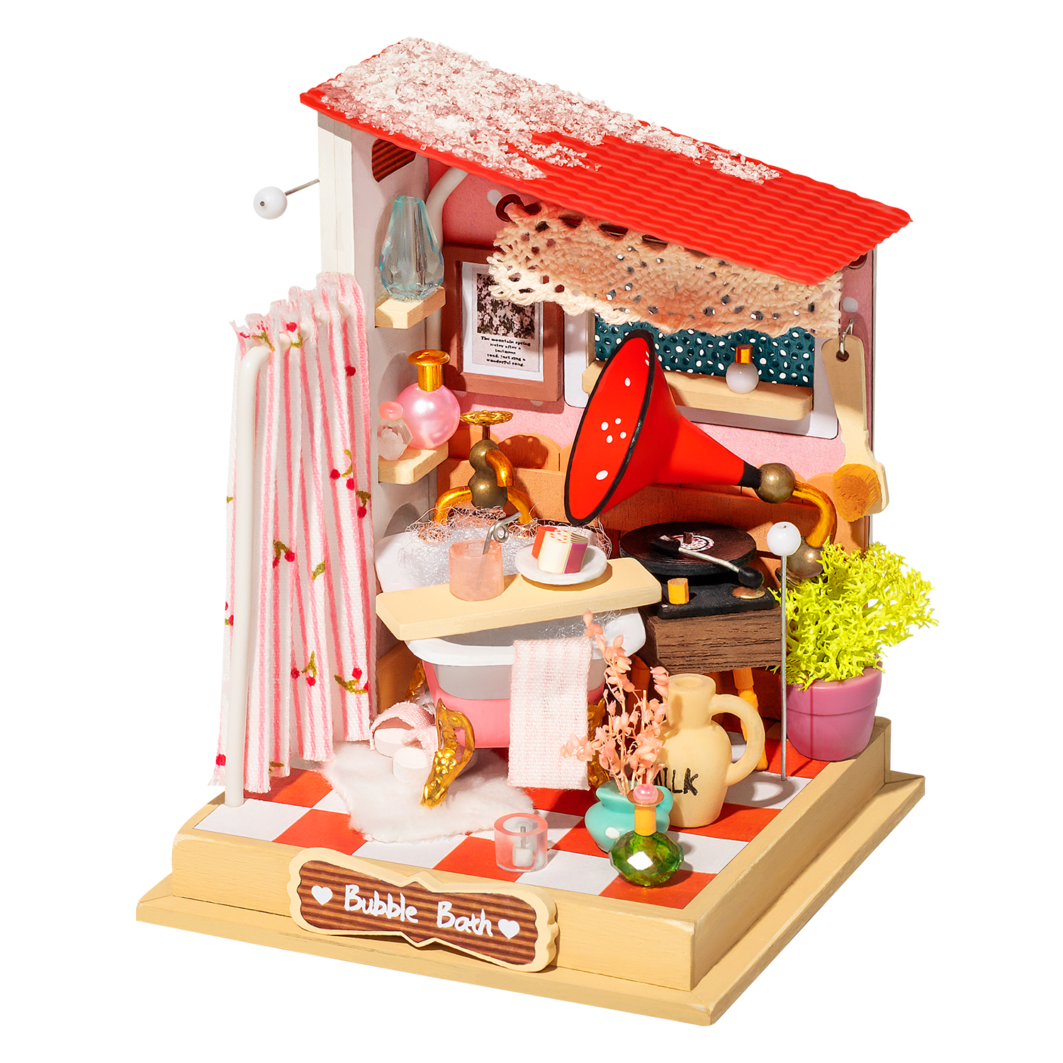 Escena de baño en miniatura con techo rojo, cortina de ducha rosa y tocadiscos. Incluye un letrero de baño de burbujas y varios elementos decorativos.