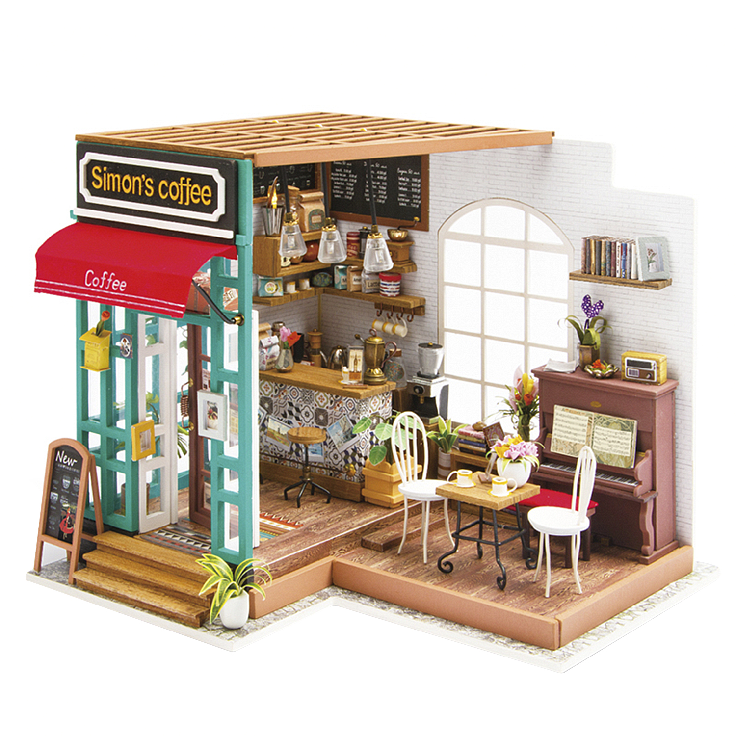 Mini kahve dükkanı modeli. Masalar, sandalyeler, bir piyano ve 'Simon's coffee' yazan bir tabela var.