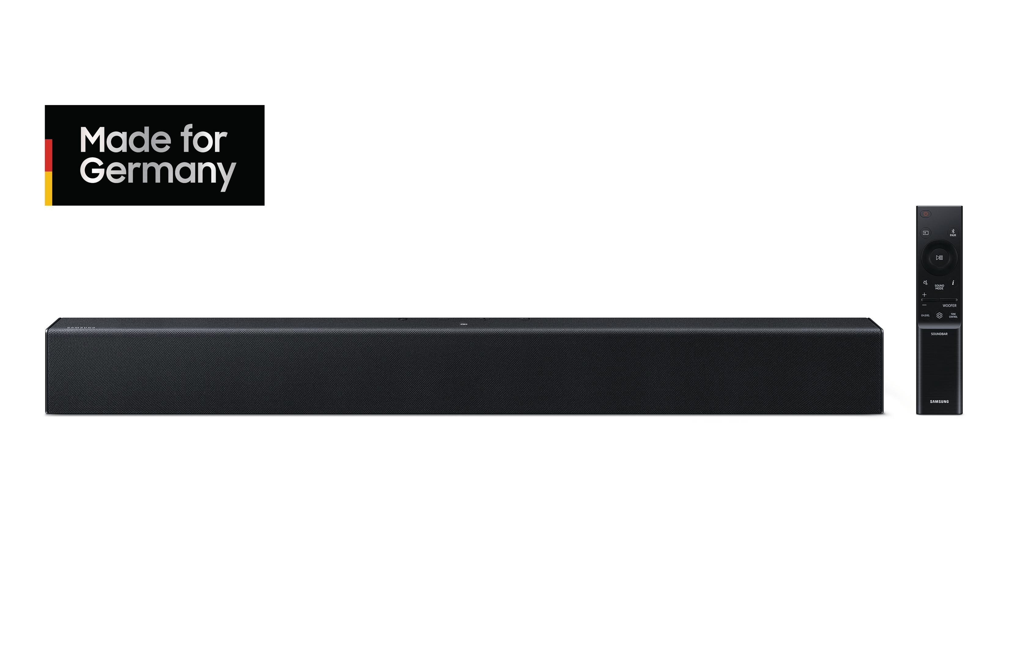 Czarny soundbar i pilot na białym tle. Logo 'Made for Germany' w lewym górnym rogu.