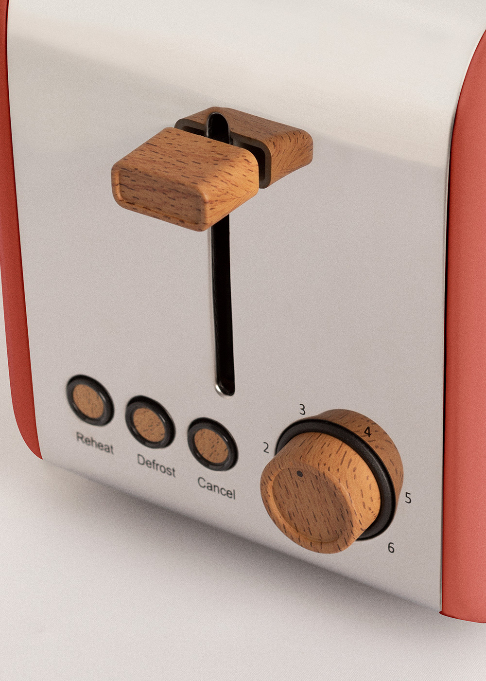 Primer plano de una tostadora. Tiene una palanca y un dial de madera. Los botones están etiquetados como Calentar, Descongelar y Cancelar. El color es rojo y gris.