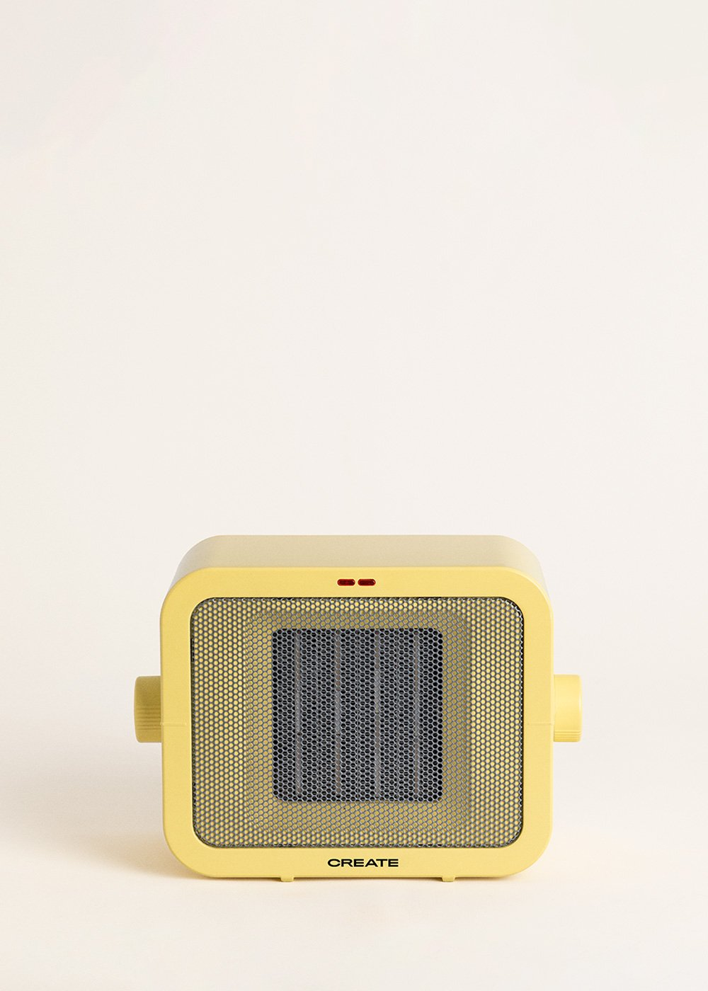Un calefactor cuadrado amarillo con una rejilla frontal. Tiene dos luces rojas en la parte superior y la palabra CREATE en la parte inferior.