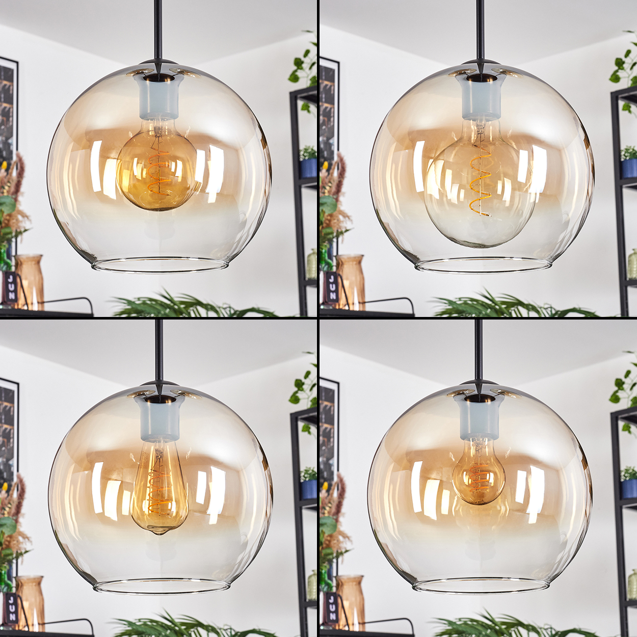 Vier Pendelleuchten aus bernsteinfarbenem Glas mit sichtbaren Glühbirnen. Schwarze Kabel und Armaturen vor einer weißen Wand. Regale mit Pflanzen im Hintergrund.