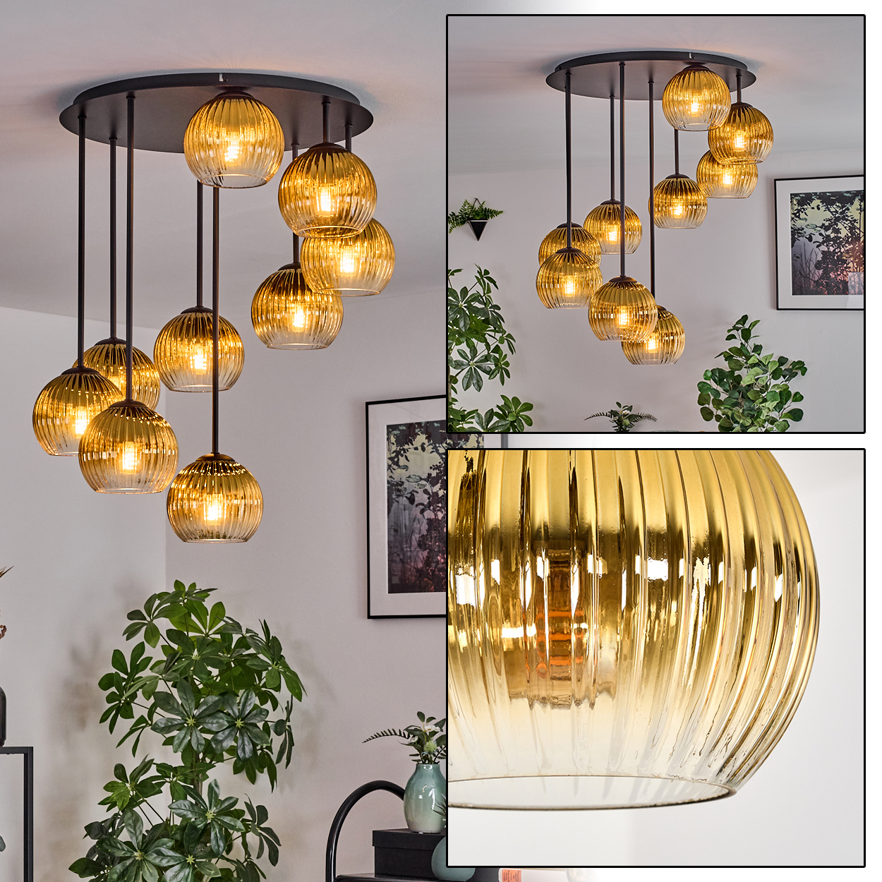 Eine moderne Deckenleuchte mit goldenen Glaskugeln hängt an einer schwarzen Deckenhalterung, umgeben von Pflanzen und Kunst.