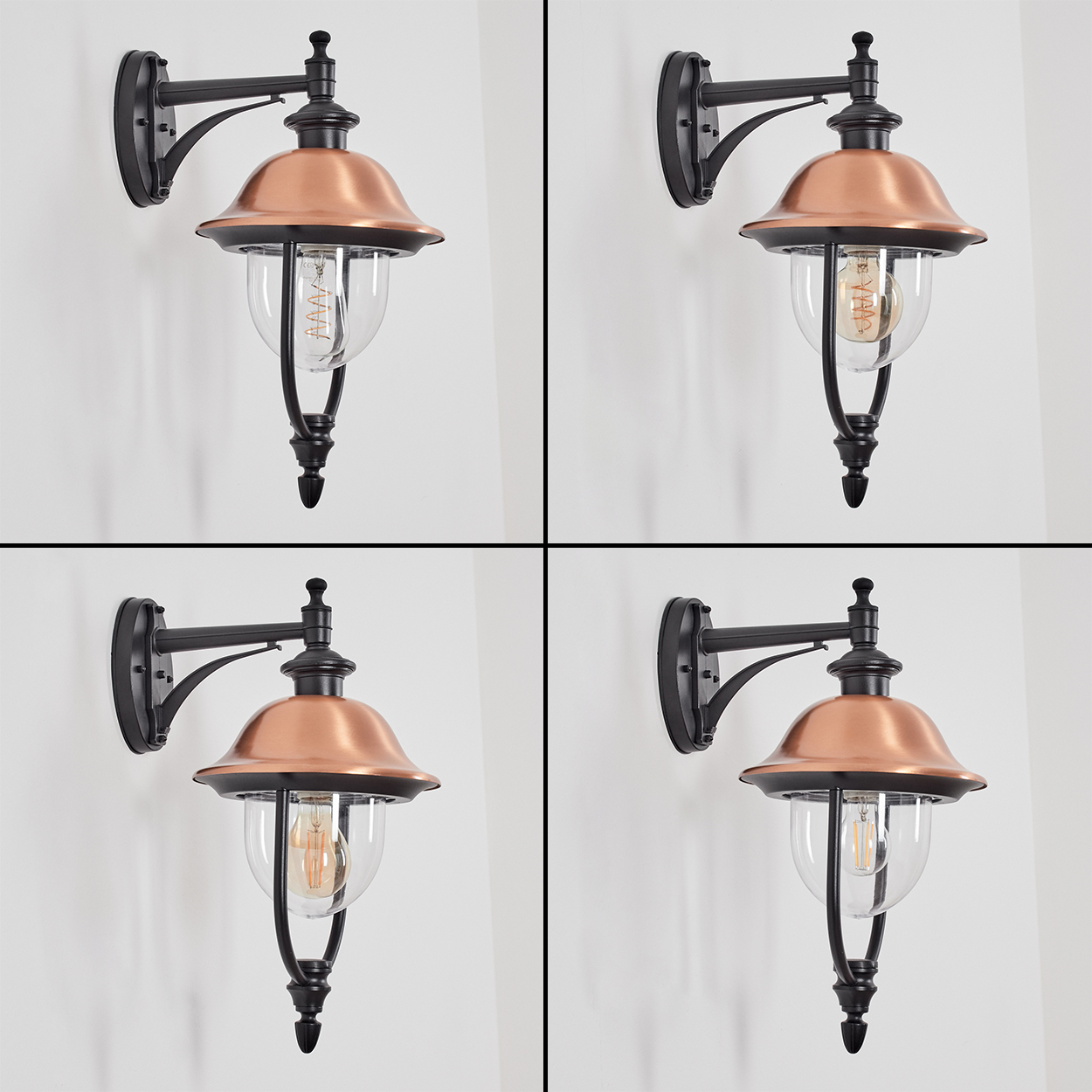Vier Außenwandleuchten. Jede hat ein kupferfarbenes Oberteil, eine klare Glaskugel und einen schwarzen Metallrahmen, der an einer weißen Wand befestigt ist.