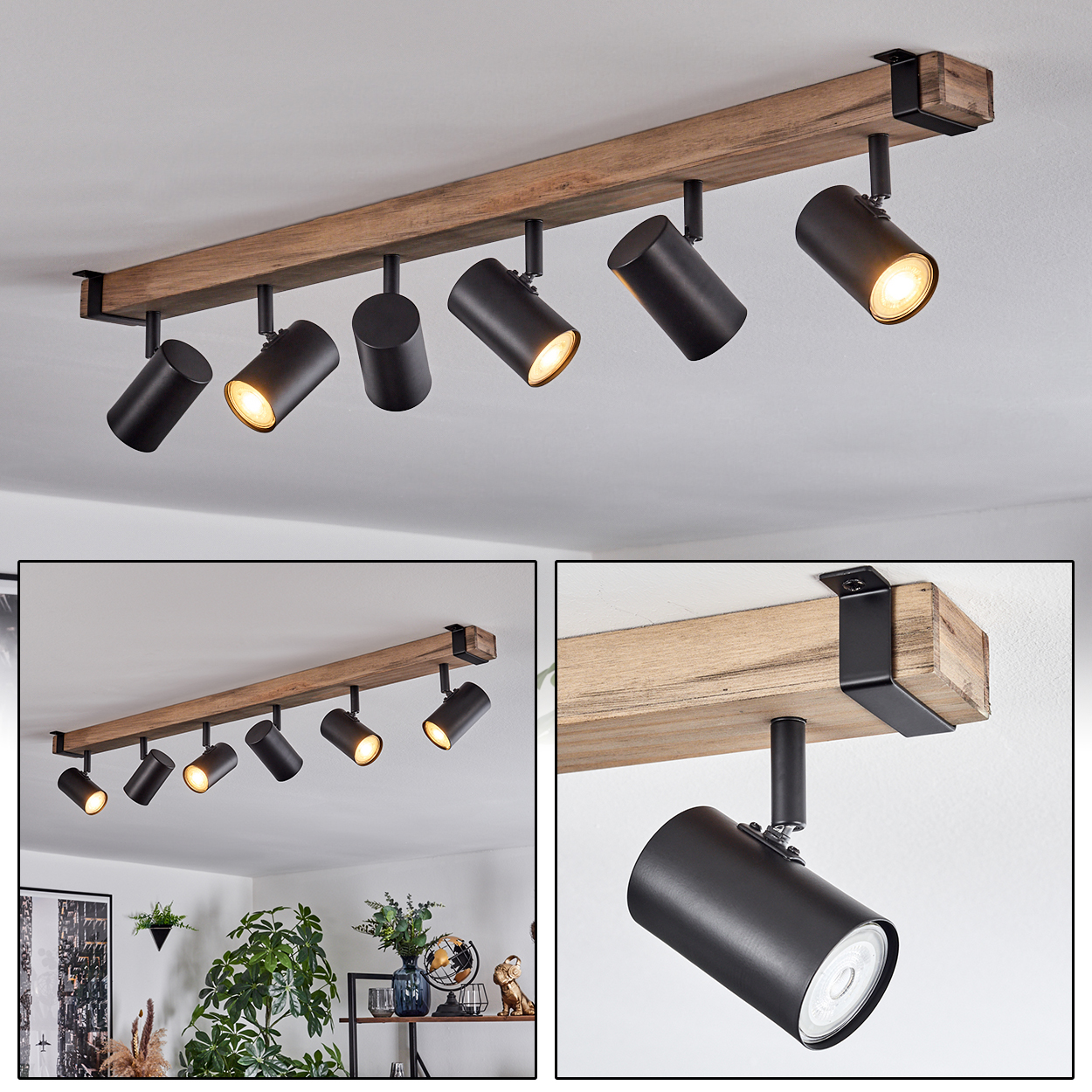 Eine Deckenleuchte mit sieben schwarzen Strahlern, die an einem Holzbalken befestigt sind. Die Lichter sind an und beleuchten den Raum.