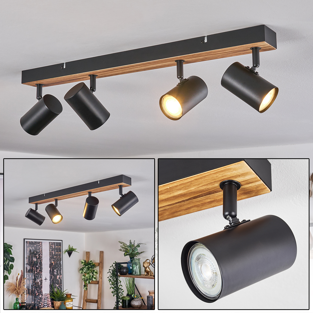 Eine Deckenleuchte mit vier schwarzen Strahlern auf einem Holzbalken. Die Lichter sind an und beleuchten den Raum.