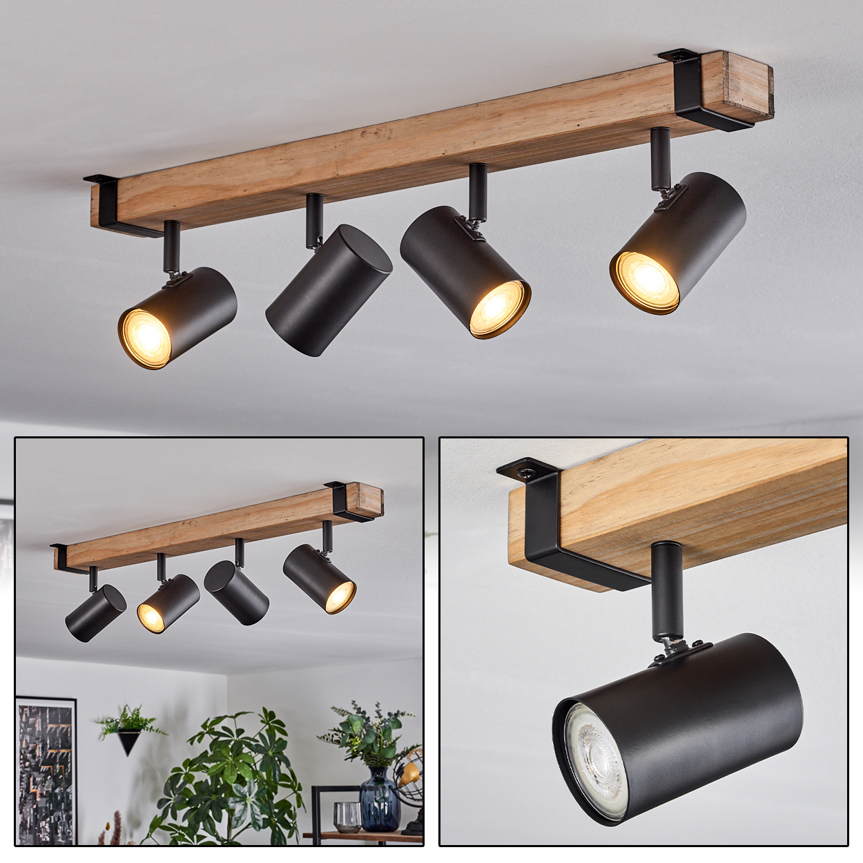 Ein Holzbalken mit vier schwarzen Strahlern. Drei Lichter sind an und leuchten nach unten. Der Balken befindet sich an einer weißen Decke.