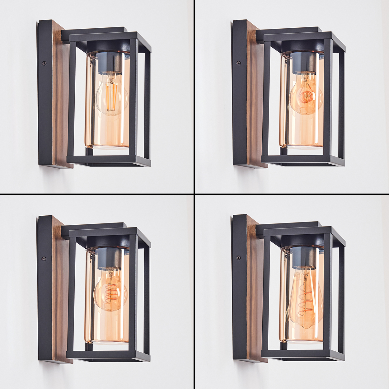 Vier Wandlampen. Jede hat einen schwarzen Rahmen, eine Holzrückseite und eine Glühbirne. Sie sind an einer weißen Wand befestigt.