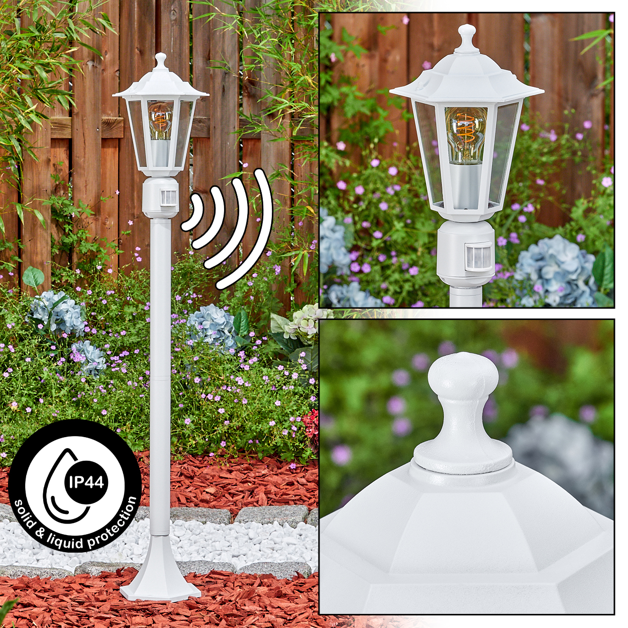 Weiße Außenlampe mit Bewegungssensor, Garteneinstellung. Holzzaun im Hintergrund, Blumen drumherum. IP44-Symbol.