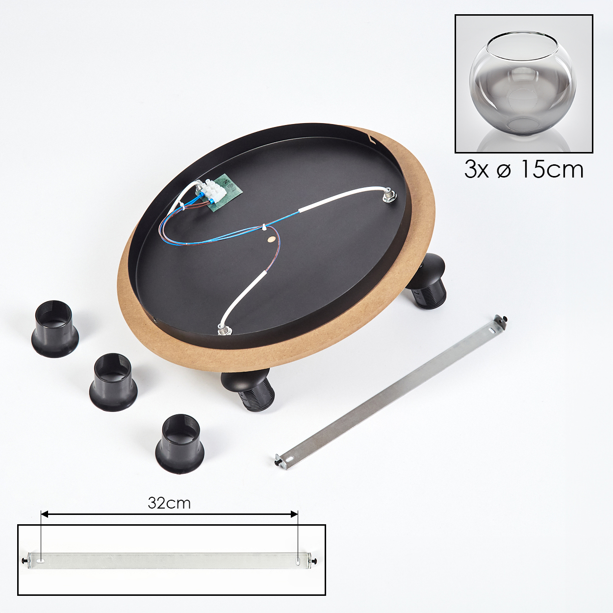 Zerlegte Lampenkomponenten: schwarze Basis, Holzring, kleine schwarze Halter, Metallstange, Glasschale, Drähte und eine elektronische Komponente.