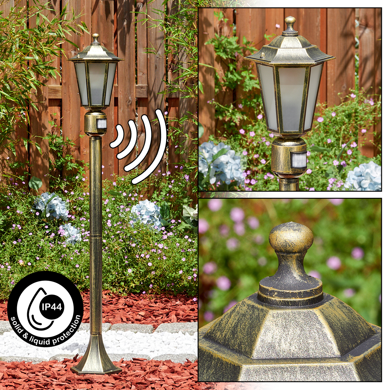 Eine bronzefarbene Außenlampe mit Sensor, in einem Garten mit Blumen und Holzzaun im Hintergrund. IP44-Schutz.